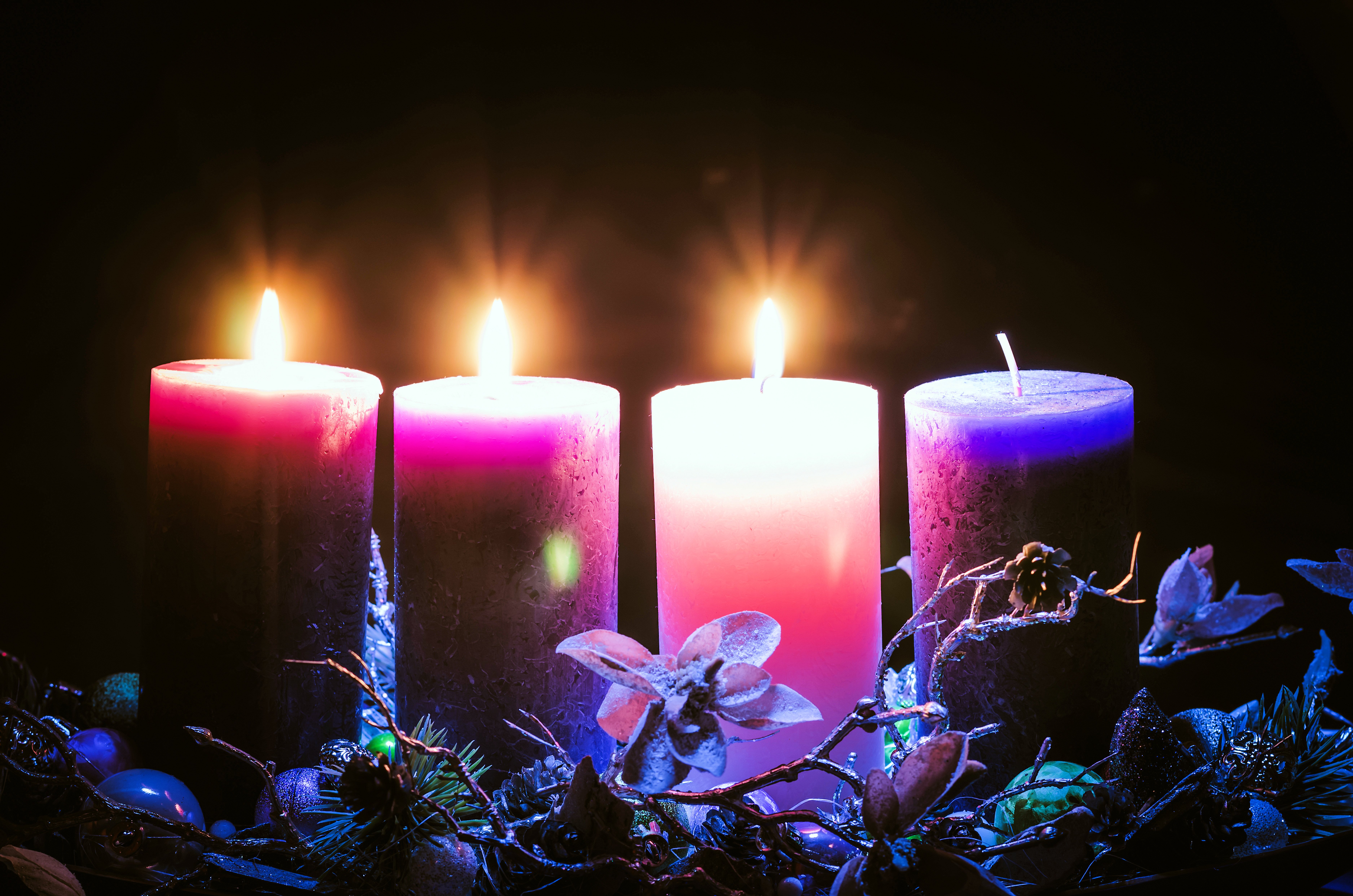 Lit pink Advent candle