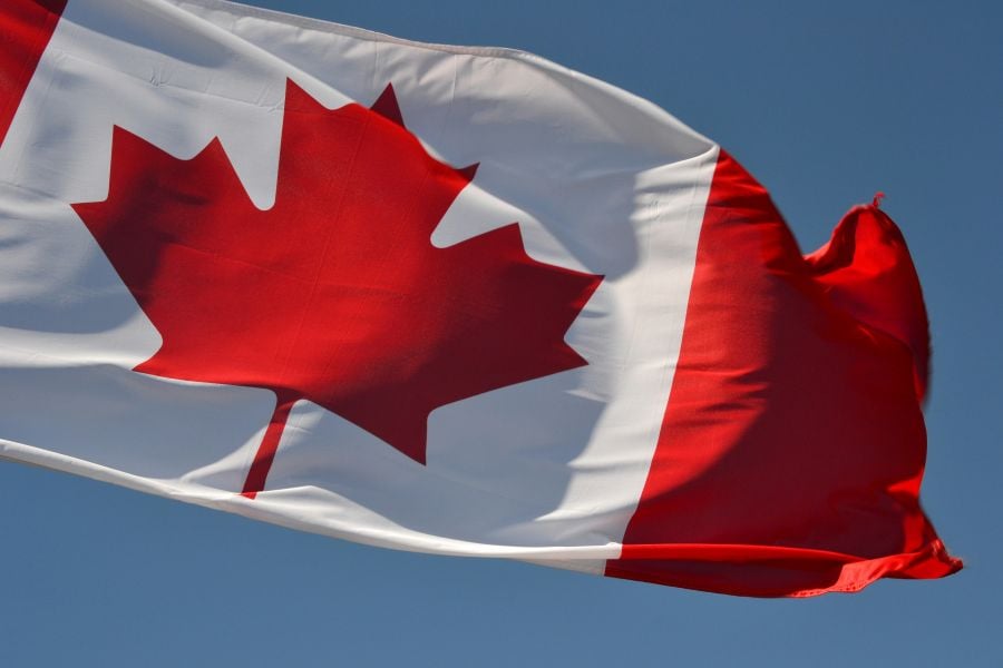 Photo of the Canadian flag flying in the breeze