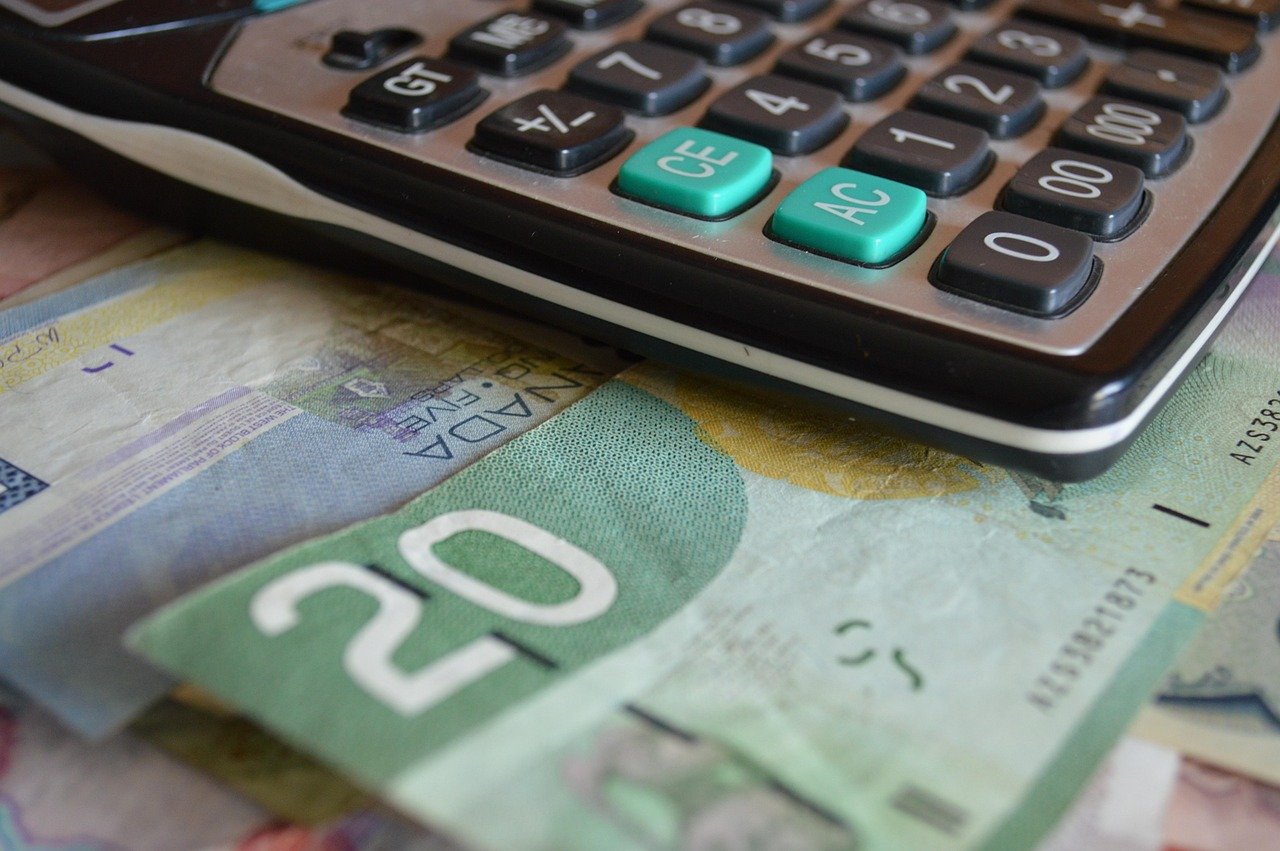 Photo of a calculator and money