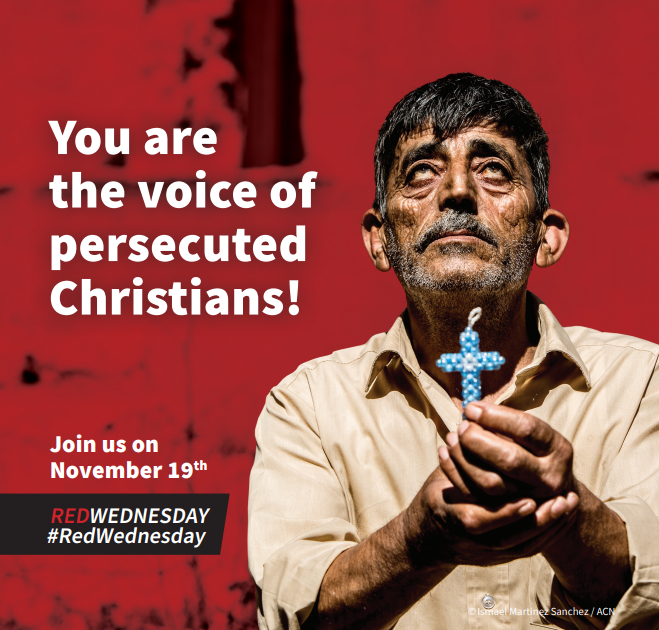 Photo of a man holding a crucifix