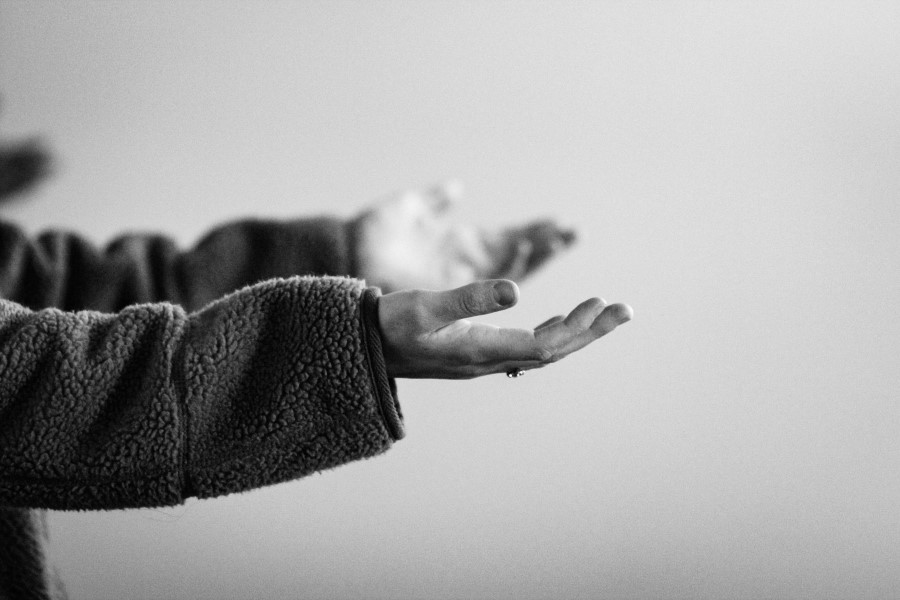 photo of outstretched hands