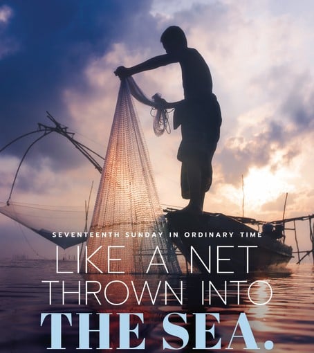 Photo of a man in his boat pulling up his fishing net
