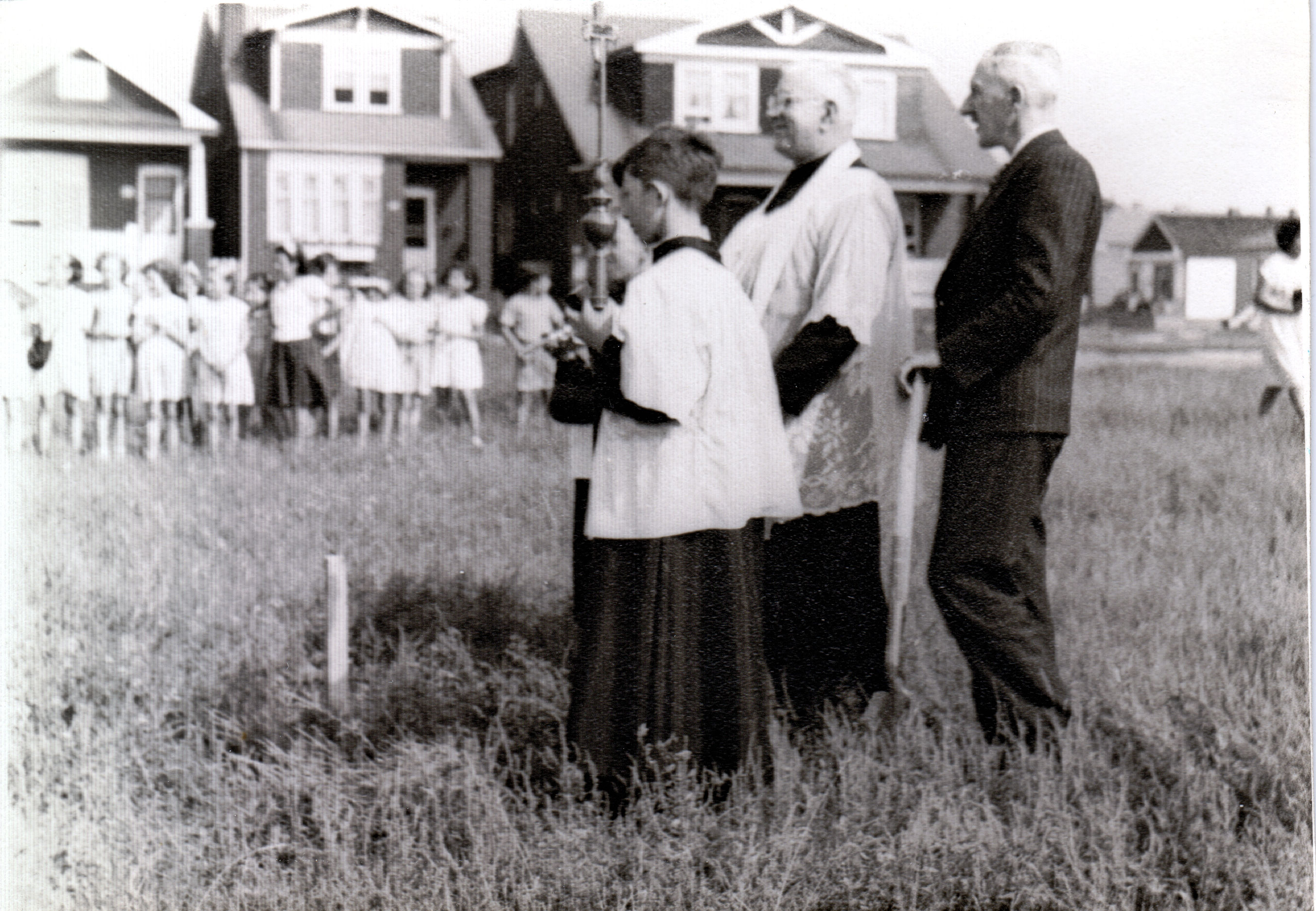 Father Miller and altar server at sod turning September 10, 1947