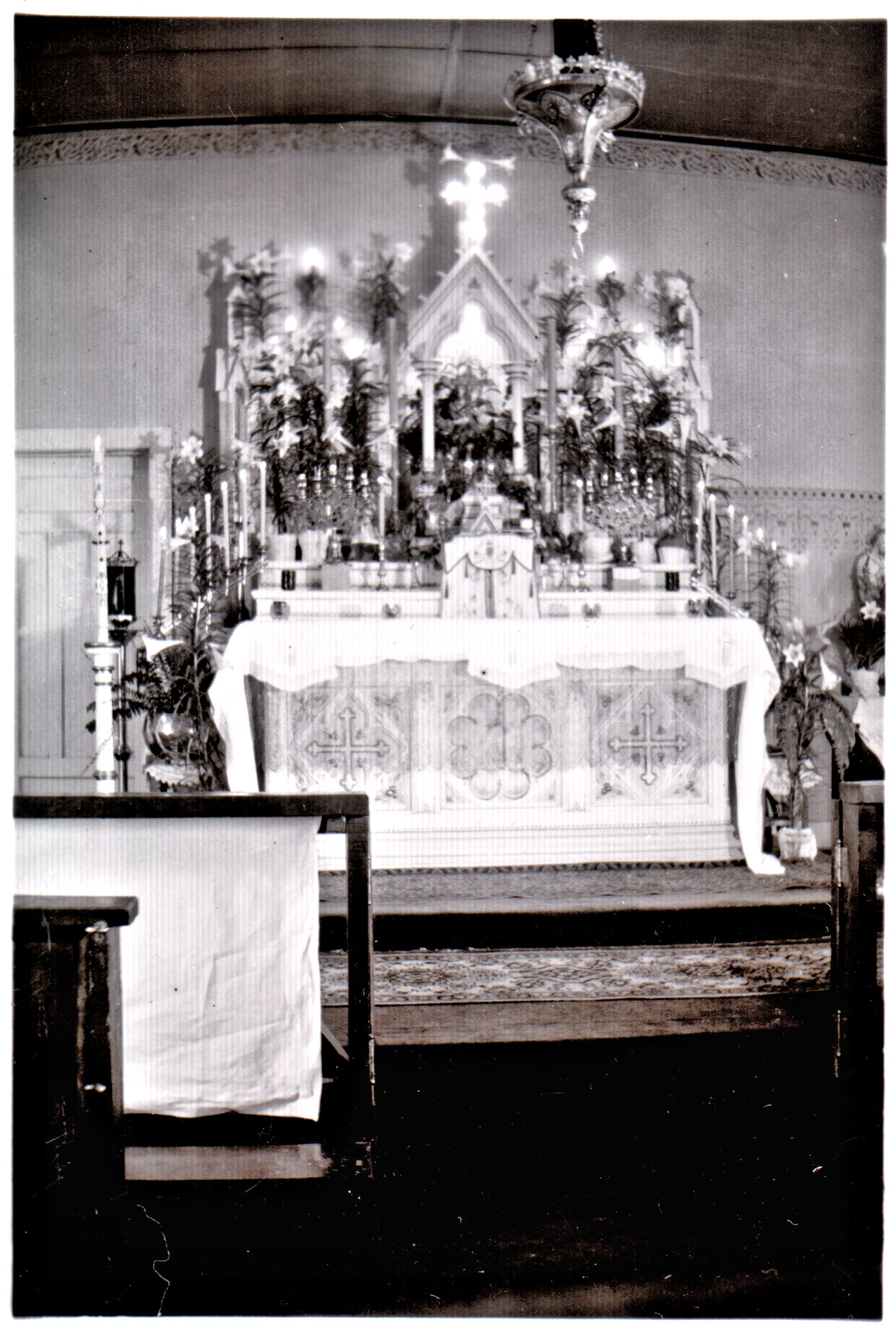 Photo of the main altar in the original church decorated for Easter
