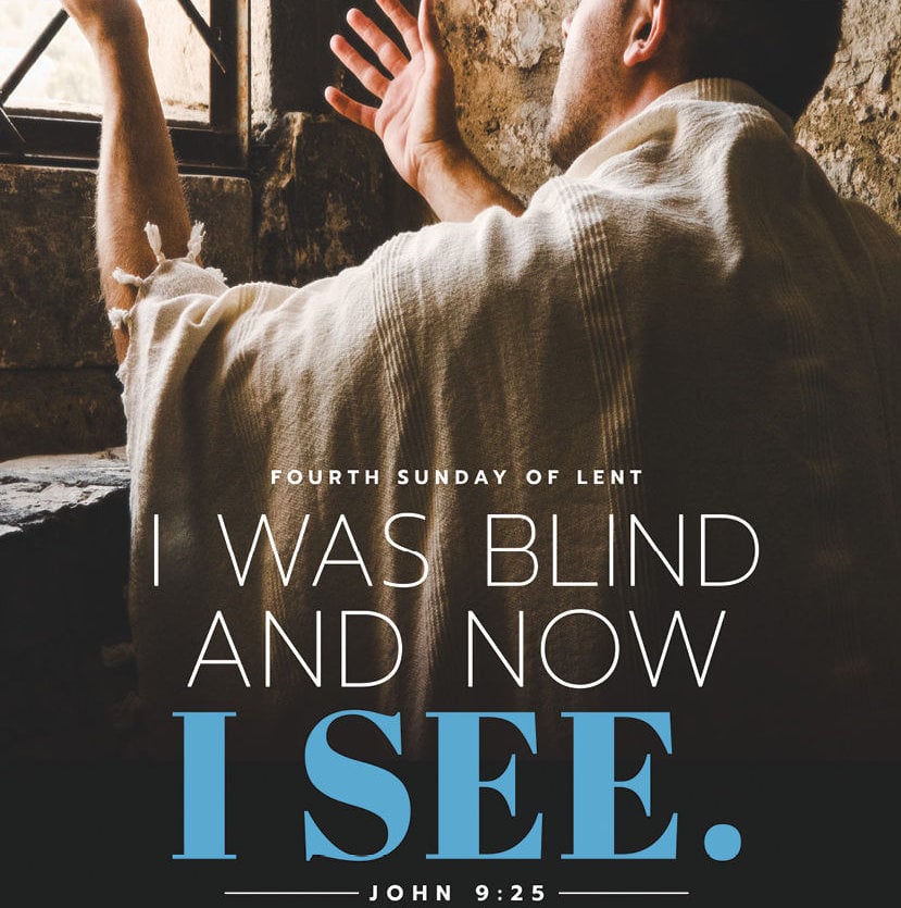 Photo of a man with his hands raised to the light