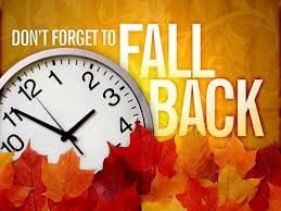 Photo of a clock with the words "Fall Back"