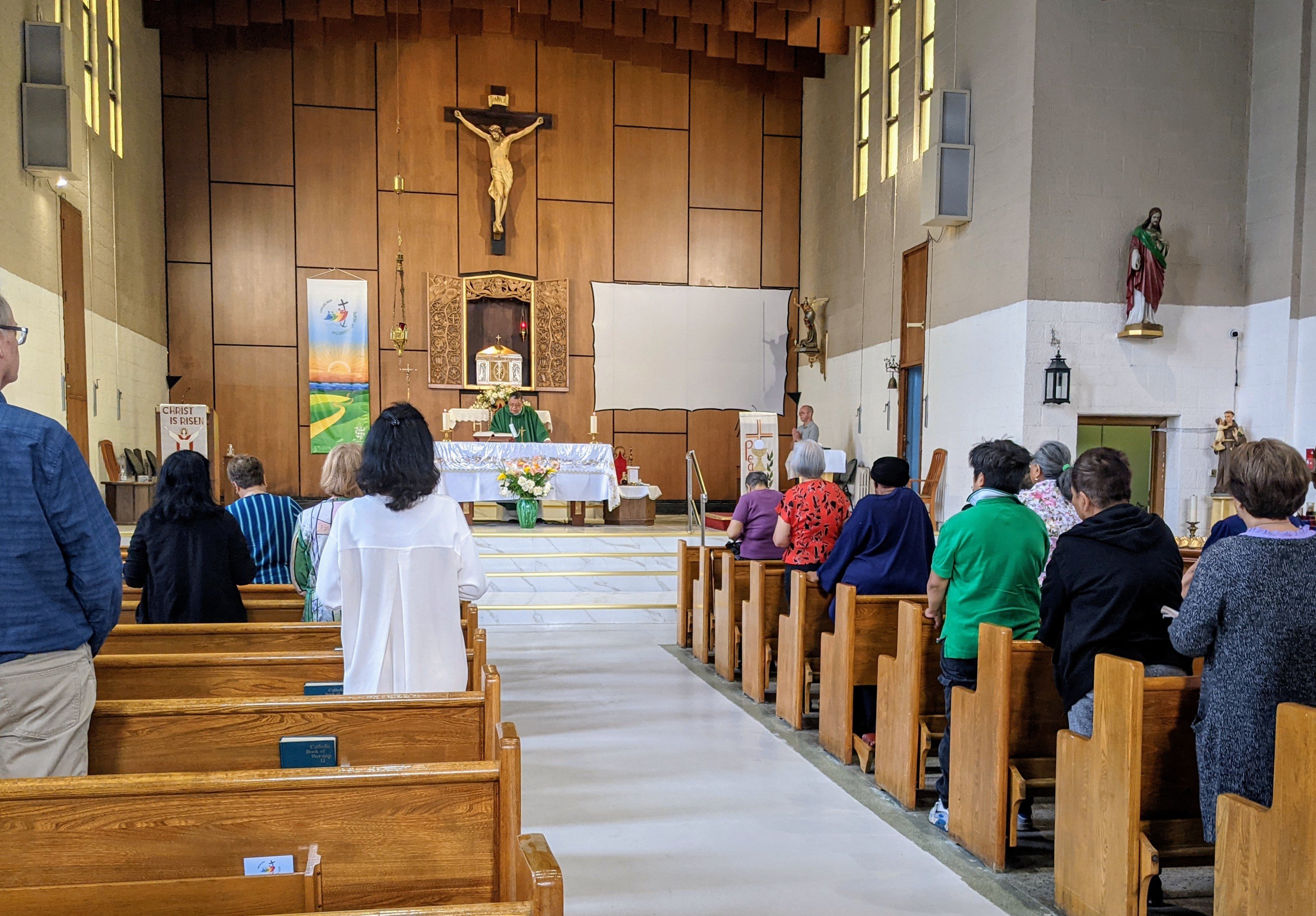 Father Freddy Claudio celebrating the first Parish Clustering Mass at Canadian Martyrs