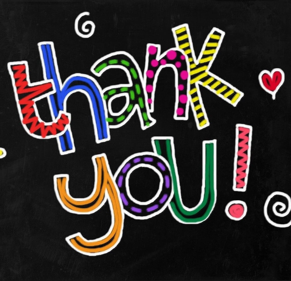 The colourful words thank you on a black background