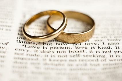Photo of wedding rings on an open bible